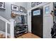 Inviting entryway featuring a decorative door and organized shoe rack at 1426 Kildaire Farm Rd, Cary, NC 27511