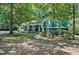 Two-story home with nice front lawn and trees, offering great shade and curb appeal at 1426 Kildaire Farm Rd, Cary, NC 27511