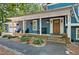 Charming brick home featuring a welcoming front porch with beautiful landscaping at 1426 Kildaire Farm Rd, Cary, NC 27511