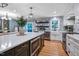Beautiful kitchen with island microwave, stainless steel appliances, decorative tiling, and backyard access at 1426 Kildaire Farm Rd, Cary, NC 27511