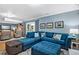 Spacious seating area with a large blue sectional and a cozy rug at 1426 Kildaire Farm Rd, Cary, NC 27511