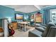 Entertainment room featuring a TV, table, and chairs with modern furniture at 1426 Kildaire Farm Rd, Cary, NC 27511