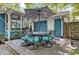 Outdoor patio area featuring an elegant dining set under a large umbrella, perfect for al fresco dining and entertaining at 1426 Kildaire Farm Rd, Cary, NC 27511