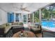 Bright and airy sunroom with a view of the pool, comfortable seating, and stylish decor for relaxing or entertaining at 1426 Kildaire Farm Rd, Cary, NC 27511