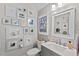 Chic bathroom with stylish decor, framed art, and a modern vanity with a sleek faucet at 1701 Berwickshire Cir, Raleigh, NC 27615