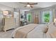 Comfortable bedroom with neutral walls and white bedding, complemented by natural light streaming through the windows at 1701 Berwickshire Cir, Raleigh, NC 27615