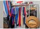 Organized closet with clothes hanging on a rod, offering ample storage space at 1701 Berwickshire Cir, Raleigh, NC 27615