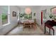 Charming dining room with a round table, woven chairs, natural light, and stylish decor at 1701 Berwickshire Cir, Raleigh, NC 27615