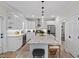 Modern kitchen with granite countertops, stainless steel appliances, and a spacious center island at 1701 Berwickshire Cir, Raleigh, NC 27615