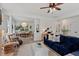 Open-concept living room and dining area with stylish furnishings, natural light, and hardwood floors at 1701 Berwickshire Cir, Raleigh, NC 27615