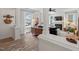 Open-concept living room featuring hardwood floors, and a view to the living room with a fireplace at 1701 Berwickshire Cir, Raleigh, NC 27615