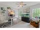 Bright office with an aquarium, built-in bookcase, and two windows offering natural light at 1701 Berwickshire Cir, Raleigh, NC 27615