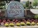 Entrance sign for Park Grove neighborhood, featuring beautiful landscaping and a stone base at 1831 Devonridge Dr, Fuquay Varina, NC 27526