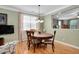 Inviting dining room with natural light and wooden furniture providing a cozy place to gather at 1831 Devonridge Dr, Fuquay Varina, NC 27526