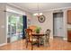 Bright dining area with sliding glass doors, features a backyard view at 1831 Devonridge Dr, Fuquay Varina, NC 27526