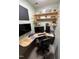 Comfortable home office setup with unique shelving and desk design, perfect for productivity at 1831 Devonridge Dr, Fuquay Varina, NC 27526