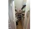 Walk-in pantry with floor-to-ceiling shelving stocked with food and household items at 1831 Devonridge Dr, Fuquay Varina, NC 27526