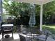 Outdoor patio with barbecue grill, patio umbrella, and seating, perfect for outdoor dining at 1831 Devonridge Dr, Fuquay Varina, NC 27526