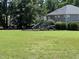 Community playground with slides and climbing structures for outdoor fun and recreation at 1831 Devonridge Dr, Fuquay Varina, NC 27526
