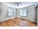 Bedroom with hardwood flooring and two windows at 1907 Bivins St, Durham, NC 27707