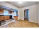 Open concept living space with hardwood floors, adjoining kitchen, and natural light at 1907 Bivins St, Durham, NC 27707