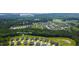 Aerial view of a residential community, showcasing homes, landscaping, and neighborhood amenities at 199 High Woods Rdg, Chapel Hill, NC 27517