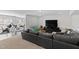 Spacious basement featuring a comfortable seating area, carpet flooring, and home workout machines at 199 High Woods Rdg, Chapel Hill, NC 27517
