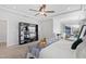Bright bedroom featuring a ceiling fan, TV, and cozy reading nook at 199 High Woods Rdg, Chapel Hill, NC 27517