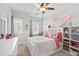 Bright bedroom with two windows, a full-size bed, and whimsical decor at 199 High Woods Rdg, Chapel Hill, NC 27517