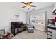 Cozy Bedroom with a dark wood crib, comfortable armchair, and plenty of natural light from the window at 199 High Woods Rdg, Chapel Hill, NC 27517