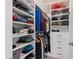Spacious walk-in closet with custom shelving and drawers for organization at 199 High Woods Rdg, Chapel Hill, NC 27517
