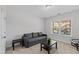 Cozy room with pullout sofa bed, neutral walls, carpet flooring and natural light streaming through window at 199 High Woods Rdg, Chapel Hill, NC 27517