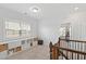 Bright landing area features built-in shelving, natural light, and easy access to upstairs bedrooms at 199 High Woods Rdg, Chapel Hill, NC 27517