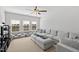 Spacious living room featuring natural light from many windows and a comfortable sofa at 199 High Woods Rdg, Chapel Hill, NC 27517