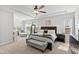 Bright and airy main bedroom with tray ceilings, sitting area, and plenty of natural light at 199 High Woods Rdg, Chapel Hill, NC 27517