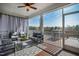Relaxing screened-in porch with comfortable seating and scenic views at 199 High Woods Rdg, Chapel Hill, NC 27517