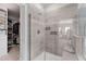 Modern glass shower with tiled walls and a convenient bench at 199 High Woods Rdg, Chapel Hill, NC 27517