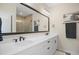 Bathroom features a double sink vanity with quartz countertops and a large framed mirror at 2055 Eva Pearl Dr, Apex, NC 27502