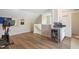 Spacious bonus room with wood floors and a wet bar with a wine refrigerator at 2055 Eva Pearl Dr, Apex, NC 27502