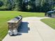 Outdoor grilling area with countertop and stone base, perfect for community gatherings and cookouts at 2055 Eva Pearl Dr, Apex, NC 27502