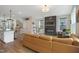Open-concept living area with a comfortable seating arrangement and a seamless flow to the kitchen at 2055 Eva Pearl Dr, Apex, NC 27502