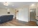 Living room featuring a Murphy bed, and stairs leading to the second level at 2055 Eva Pearl Dr, Apex, NC 27502