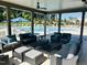 Comfortable outdoor lounge area with sofas and tables overlooking the refreshing community pool at 2055 Eva Pearl Dr, Apex, NC 27502