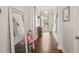 Welcoming entryway with wood floors, elegant mirror, and views of the front door at 212 Golf Vista Trl, Holly Springs, NC 27540