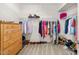 Spacious walk-in closet features ample storage space with shelving and rods at 212 Golf Vista Trl, Holly Springs, NC 27540