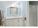 Bathroom featuring a vanity with a marble countertop and a glass-enclosed shower at 2147 Wake Dr, Raleigh, NC 27608