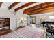 Inviting living room boasts beamed ceilings, hardwood floors, and natural light at 2147 Wake Dr, Raleigh, NC 27608