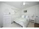 Charming bedroom with patterned bedding, a plush rug, and natural light at 2320 Marks Creek Rd, Knightdale, NC 27545
