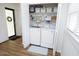 Convenient laundry closet featuring modern washer and dryer with storage shelves at 2320 Marks Creek Rd, Knightdale, NC 27545