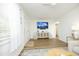 Inviting living room showcasing wood floors, decorative console, and access to entryway at 2320 Marks Creek Rd, Knightdale, NC 27545